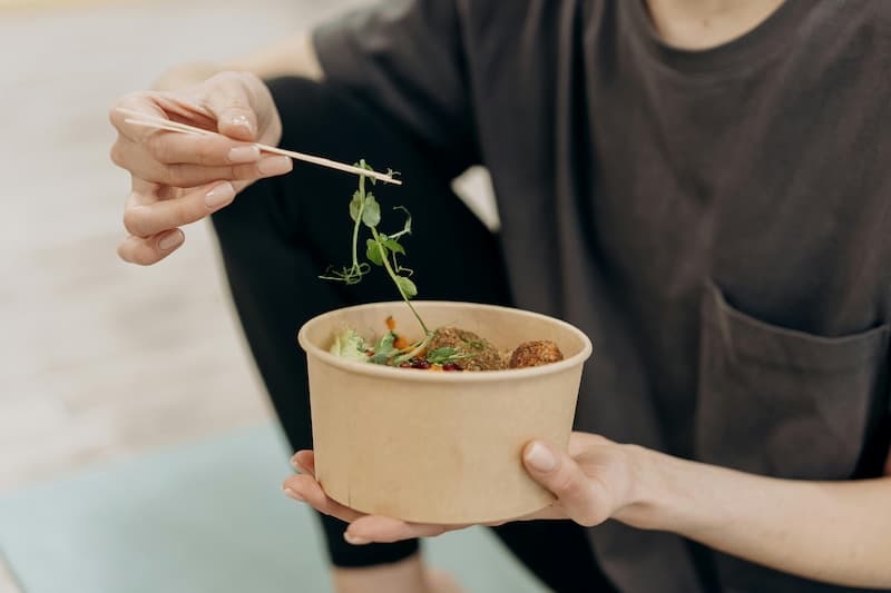 Person enjoying a wholesome, nourishing meal