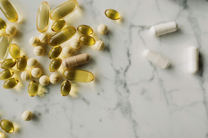 Person preparing supplements for travel